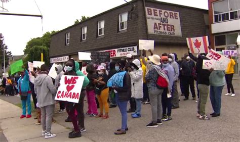 Refugees living in Etobicoke strip mall march to government offices to plead for action